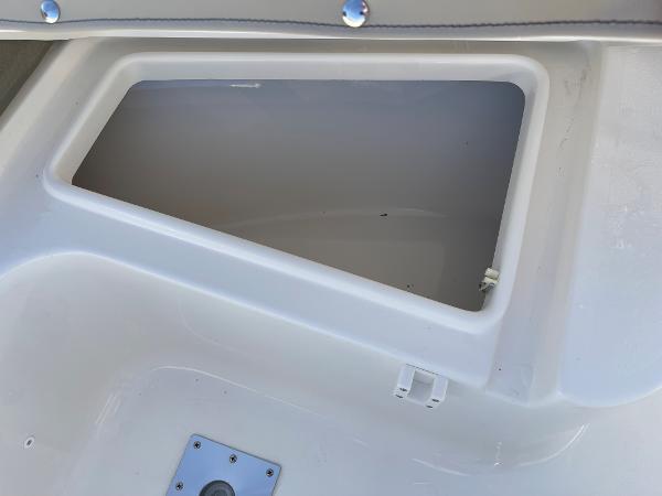 Slide: The Image of Open storage compartment on a 2025 Key West 219 FS boat. - 11
