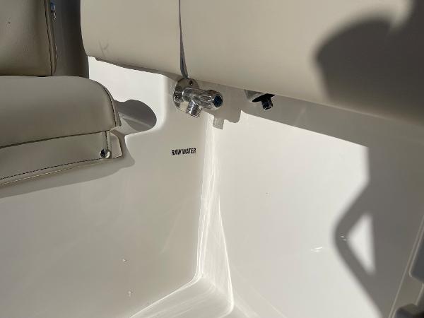 Slide: The Image of Interior view of 2025 Key West 219 FS boat, featuring raw water outlet. - 12