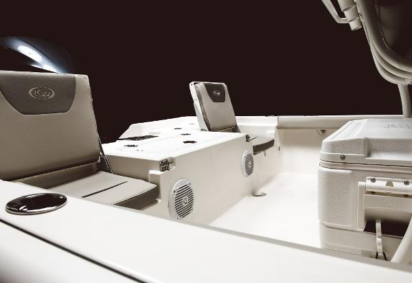 Slide: The Image of 2024 Key West 230 Bay Reef boat interior with seating and storage compartments. - 25
