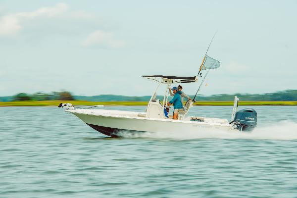 Slide: The Image of 2024 Key West 230 Bay Reef boat cruising on water. - 36