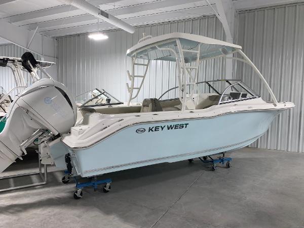 Slide: The Image of 2024 Key West 239 DFS boat in a showroom. - 0