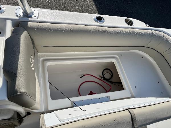 Slide: The Image of 2024 Key West 239 DFS boat storage compartment with cushioned seating. - 12
