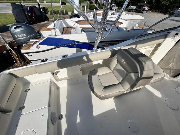 Slide: The Image of 2024 Key West 239 DFS boat interior with seating and Yamaha outboard motor. - 13
