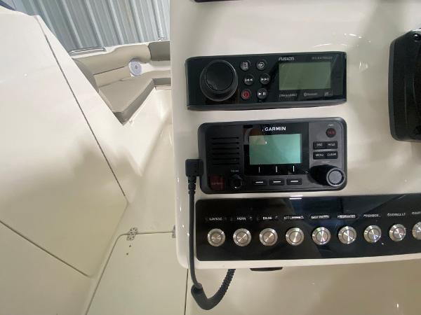 Slide: The Image of 2024 Key West 239 DFS boat dashboard with Garmin navigation system and control panel. - 16