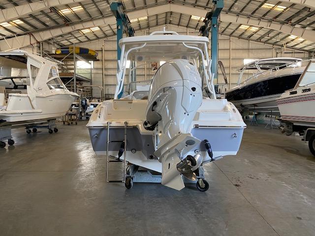Slide: The Image of 2024 Key West 239 DFS boat in a storage facility. - 2