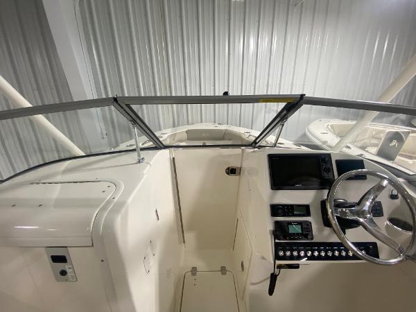 Slide: The Image of 2024 Key West 239 DFS boat dashboard and steering wheel. - 21