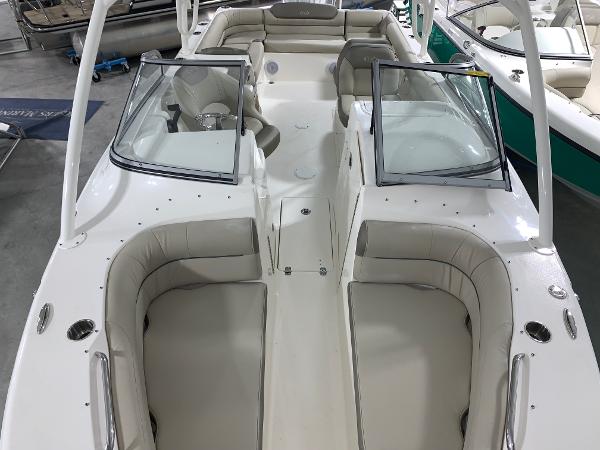 Slide: The Image of 2024 Key West 239 DFS boat interior with dual consoles and spacious seating. - 4