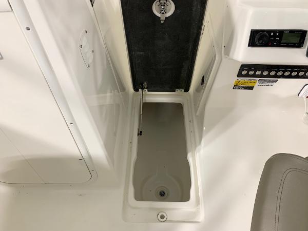 Slide: The Image of 2024 Key West 239 DFS boat storage compartment and control panel. - 6