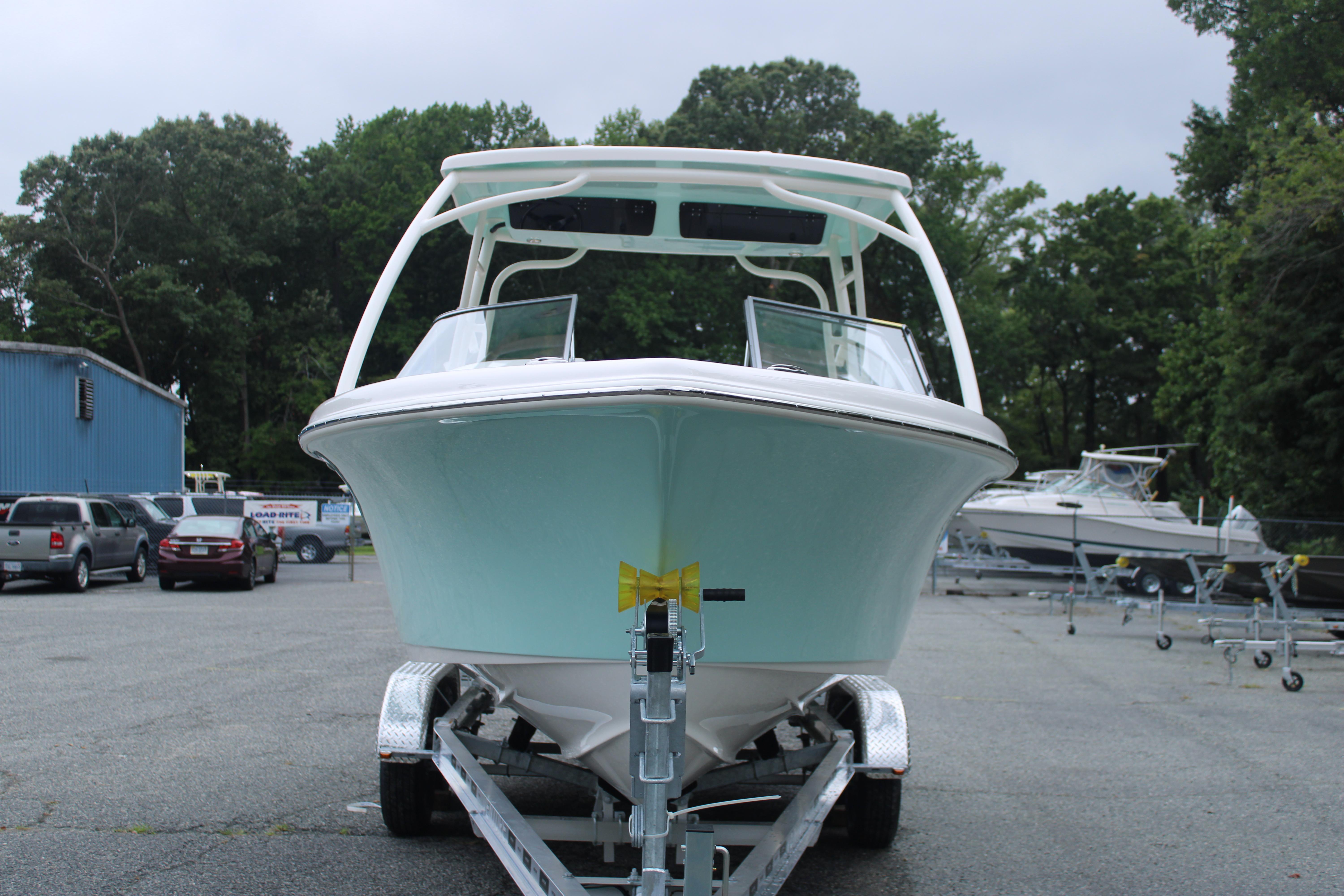 Slide: The Image of 2026 Key West 239 DFS boat on trailer in parking lot. - 2