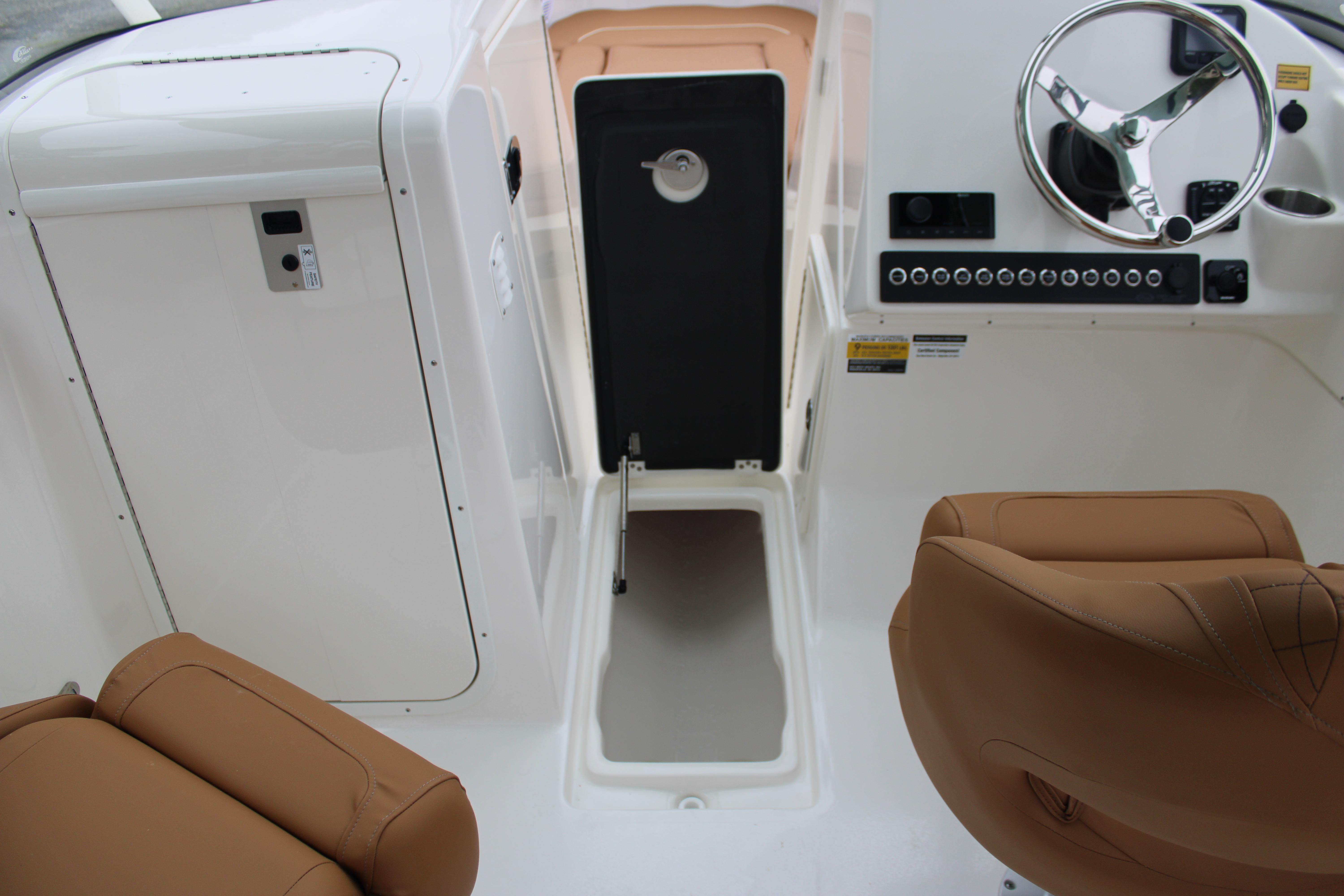 Slide: The Image of Interior view of 2026 Key West 239 DFS boat cockpit with steering wheel and seating. - 20