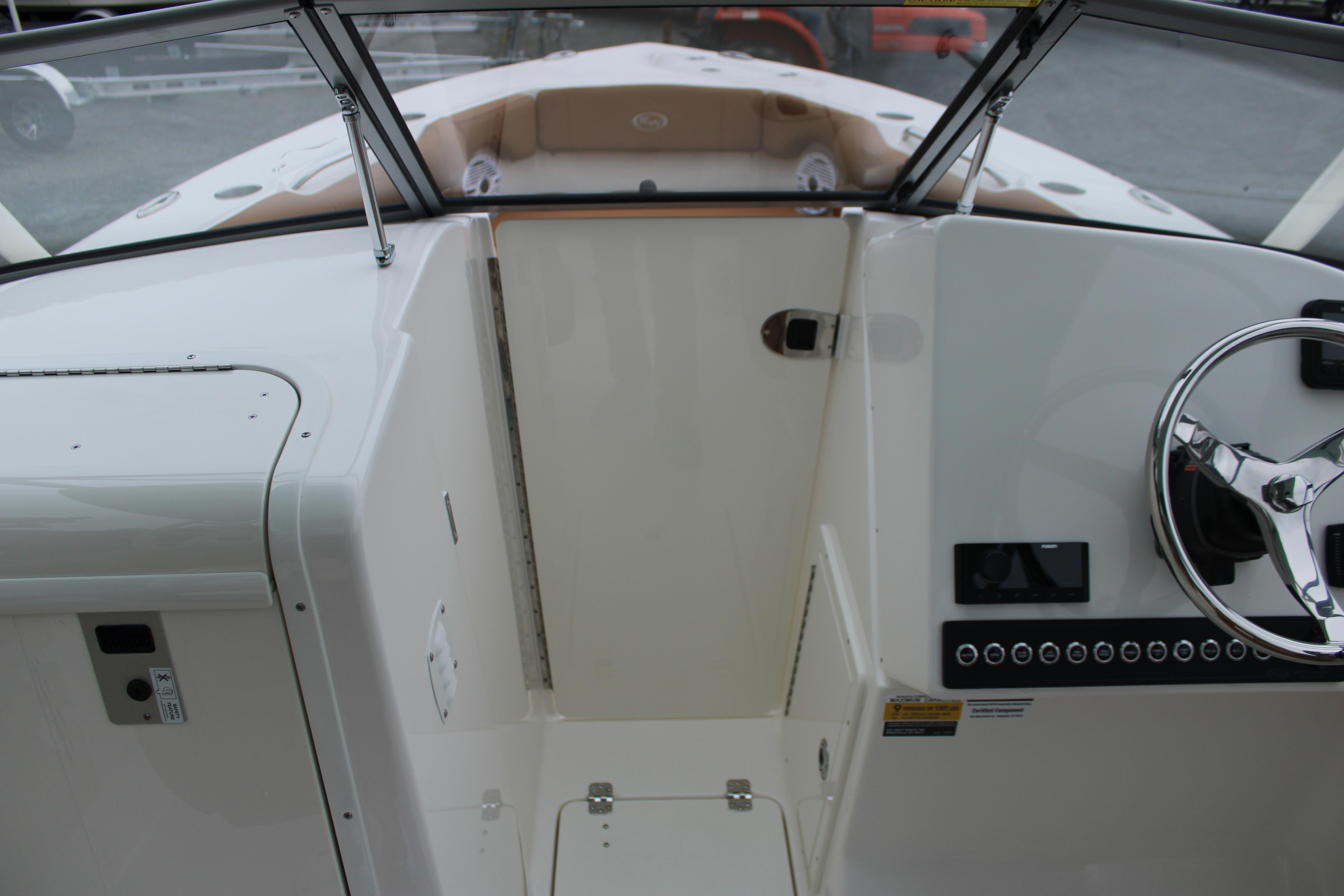 Slide: The Image of 2026 Key West 239 DFS boat interior with steering wheel and dashboard controls. - 21