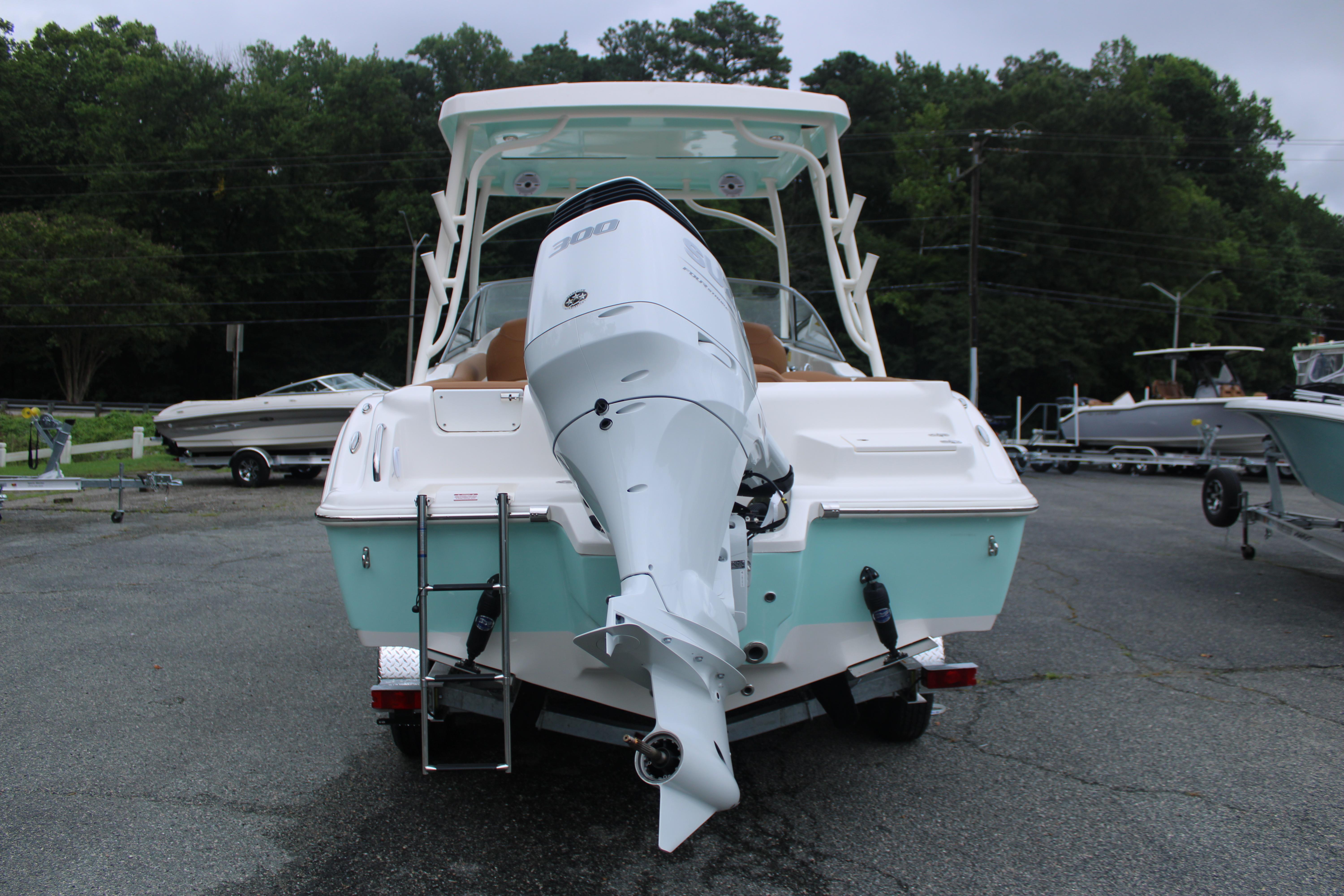 Slide: The Image of 2026 Key West 239 DFS boat with powerful outboard motor, parked on a trailer. - 6