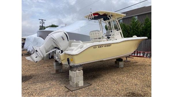 Slide: The Image of 2023 Key West 239 FS boat on blocks in a yard. - 6