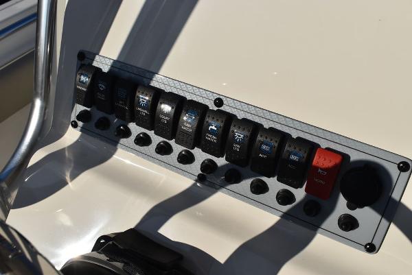 Slide: The Image of Control panel of 2024 Key West 239 FS boat with labeled switches. - 16