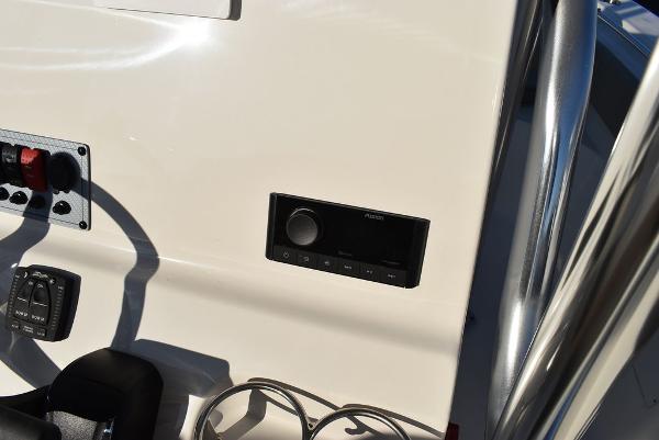 Slide: The Image of 2024 Key West 239 FS boat dashboard with control panel and audio system. - 19