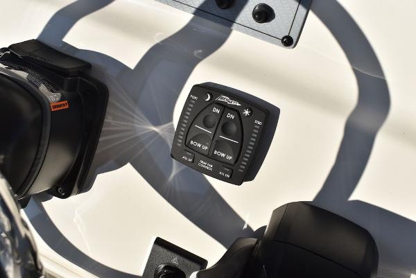 Slide: The Image of 2024 Key West 239 FS boat control panel with trim tab switches. - 22