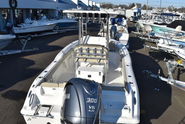 Slide: The Image of 2024 Key West 239 FS boat with Yamaha 300 V6 engine in a marina. - 23