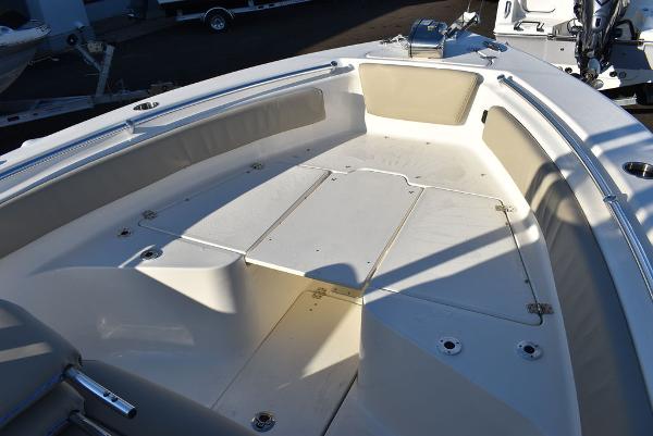 Slide: The Image of 2024 Key West 239 FS boat interior with spacious seating and storage compartments. - 33