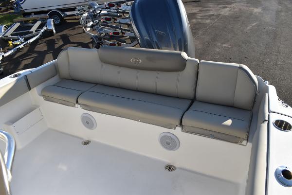Slide: The Image of 2024 Key West 239 FS boat with cushioned seating and speakers. - 43