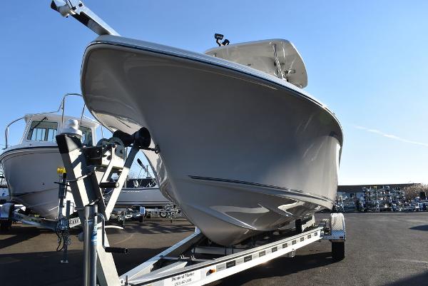 Slide: The Image of 2024 Key West 239 FS boat on trailer, displayed outdoors. - 6