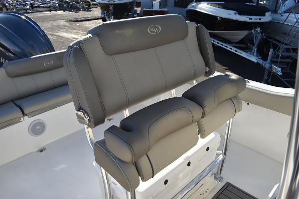 Slide: The Image of 2024 Key West 239 FS boat seating with gray cushioned seats and stainless steel frame. - 9