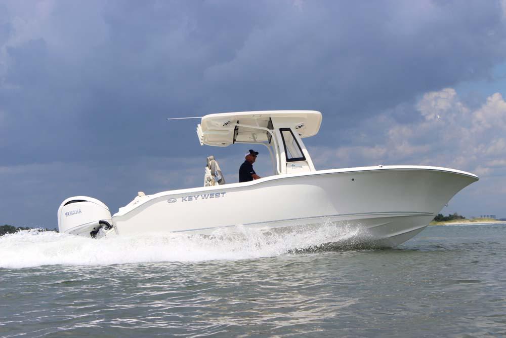 The Image of 2025 Key West 239 FSR boat cruising on water under cloudy sky. - 0