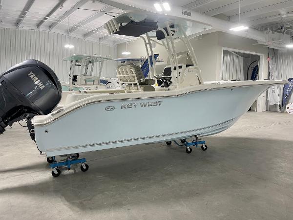 Slide: The Image of 2024 Key West 244 CC boat in showroom with Yamaha outboard motor. - 1
