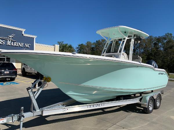 Slide: The Image of 2024 Key West 244 CC boat on a trailer at a dealership. - 1