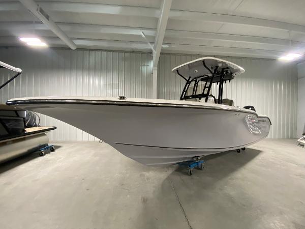Slide: The Image of 2024 Key West 244 CC boat in a showroom. - 1