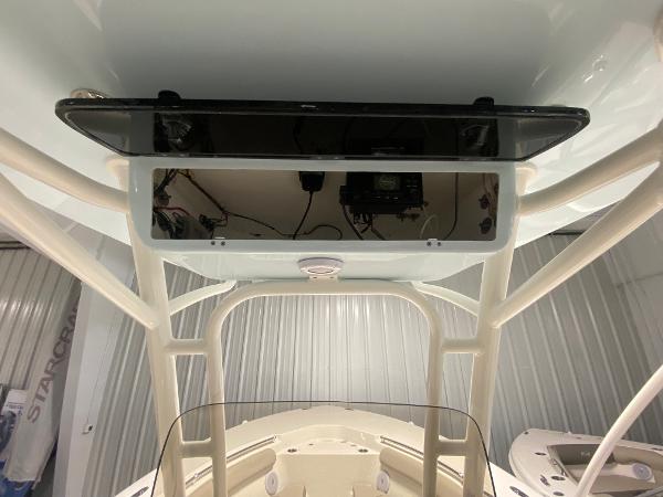 Slide: The Image of 2024 Key West 244 CC center console boat interior with T-top and electronics. - 10