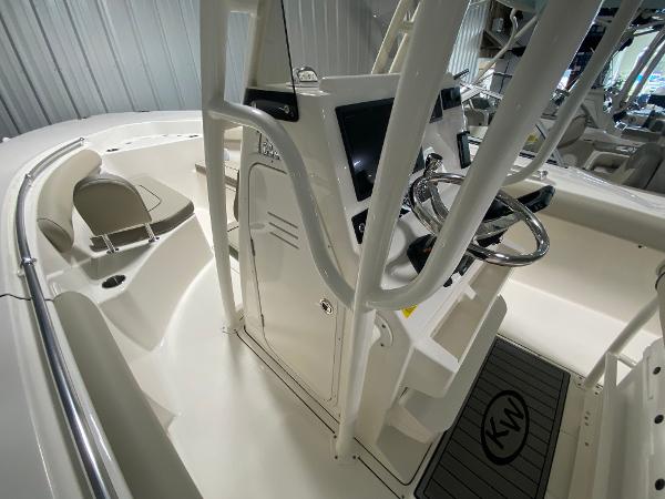 Slide: The Image of 2024 Key West 244 CC center console boat interior with helm and seating. - 11
