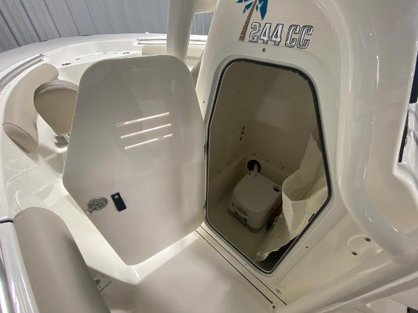 Slide: The Image of 2024 Key West 244 CC boat with open cabin door showing interior. - 12