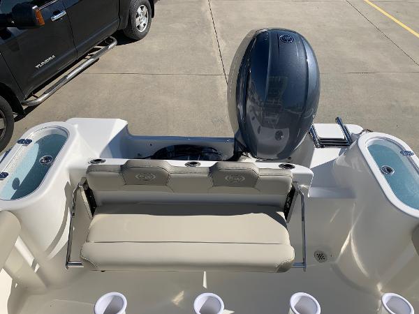 Slide: The Image of 2024 Key West 244 CC boat with rear seating and outboard motor. - 12