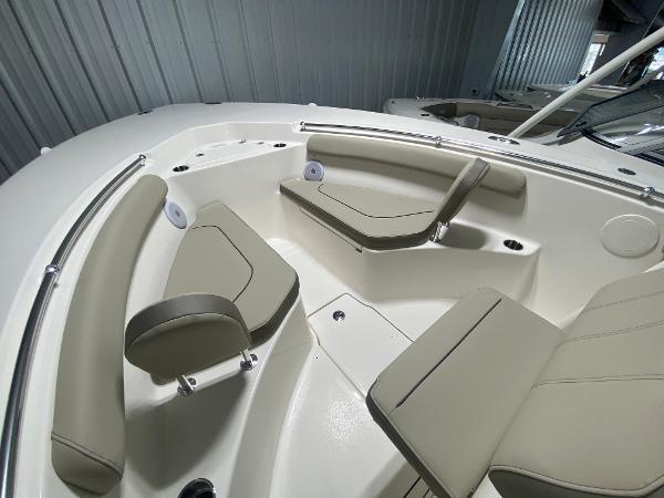 Slide: The Image of 2024 Key West 244 CC boat interior with beige seating. - 13