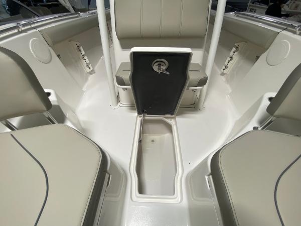 Slide: The Image of 2024 Key West 244 CC boat interior with seating and storage compartments. - 15