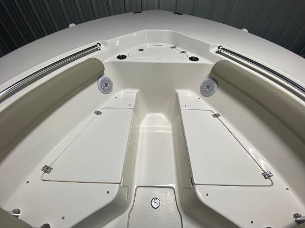 Slide: The Image of 2024 Key West 244 CC boat interior with storage compartments and seating. - 16