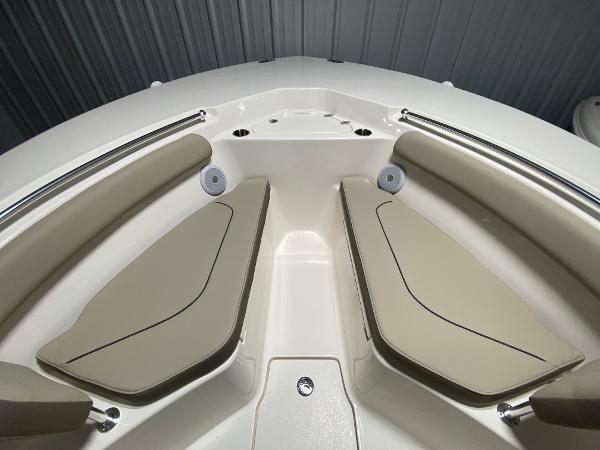 Slide: The Image of 2024 Key West 244 CC boat interior with beige seating and stainless steel rails. - 18