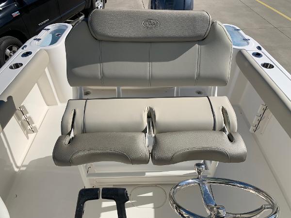 Slide: The Image of 2024 Key West 244 CC boat cockpit with dual seats and steering wheel. - 18