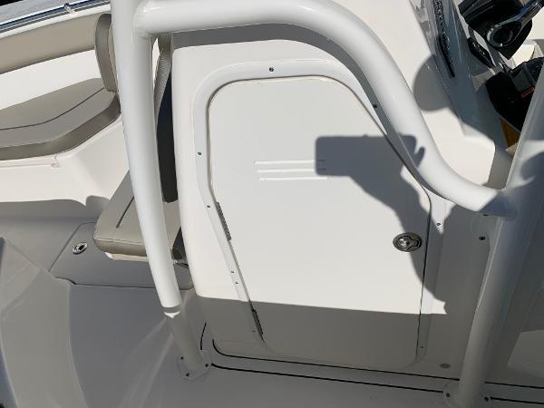 Slide: The Image of 2024 Key West 244 CC boat interior with seating and storage compartment. - 21