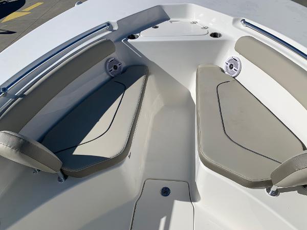 Slide: The Image of 2024 Key West 244 CC boat interior with cushioned seating and built-in speakers. - 28
