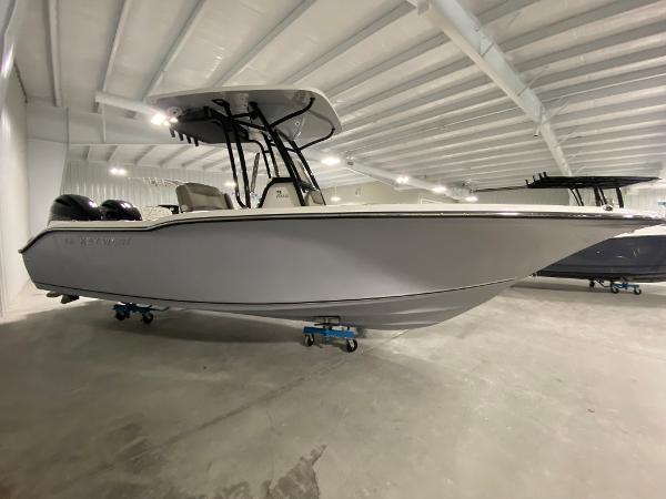 Slide: The Image of 2024 Key West 244 CC boat in indoor showroom. - 3