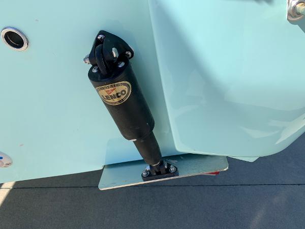 Slide: The Image of Close-up of a 2024 Key West 244 CC boat's trim tab actuator. - 32