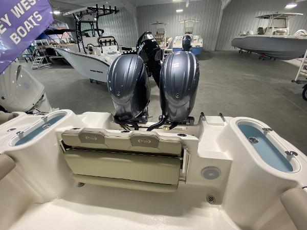 Slide: The Image of 2024 Key West 244 CC boat with dual outboard motors in showroom. - 4