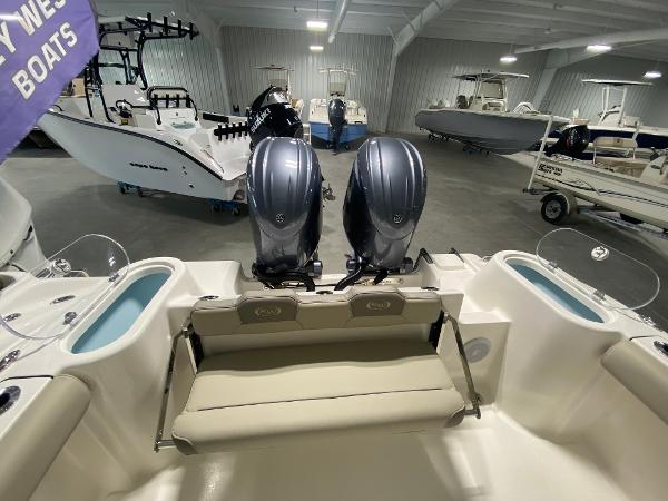 Slide: The Image of 2024 Key West 244 CC boat with dual outboard engines in showroom. - 5