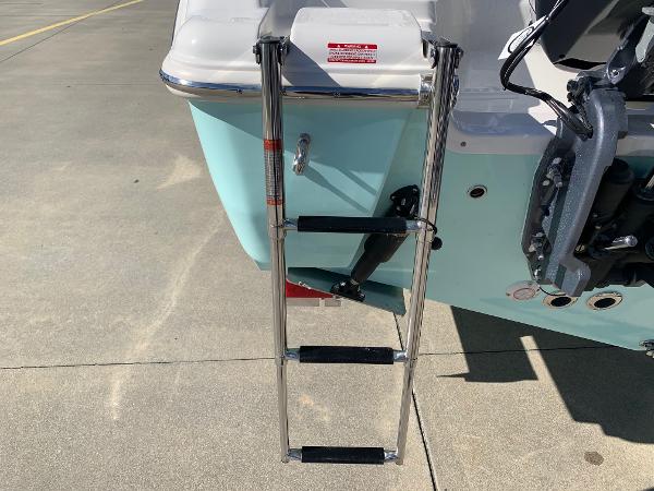 Slide: The Image of 2024 Key West 244 CC boat with a stainless steel swim ladder. - 5