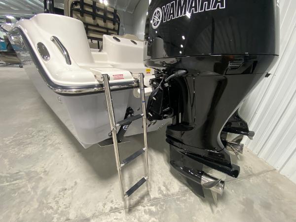 Slide: The Image of 2024 Key West 244 CC boat with Yamaha outboard motor and ladder. - 5