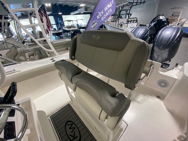 Slide: The Image of 2024 Key West 244 CC boat interior with seating and outboard motors. - 7