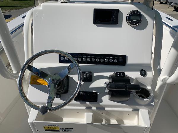Slide: The Image of 2024 Key West 244 CC boat console with steering wheel and control panel. - 8