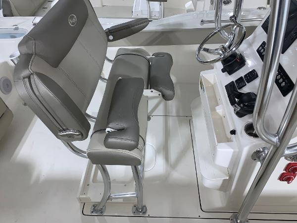 Slide: The Image of 2024 Key West 244 Center Console boat helm with dual seats and steering wheel. - 10