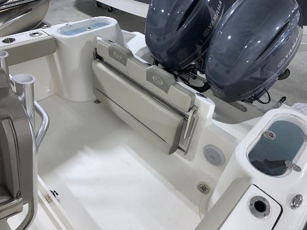 Slide: The Image of 2024 Key West 244 Center Console boat with Yamaha engines and foldable seating. - 14